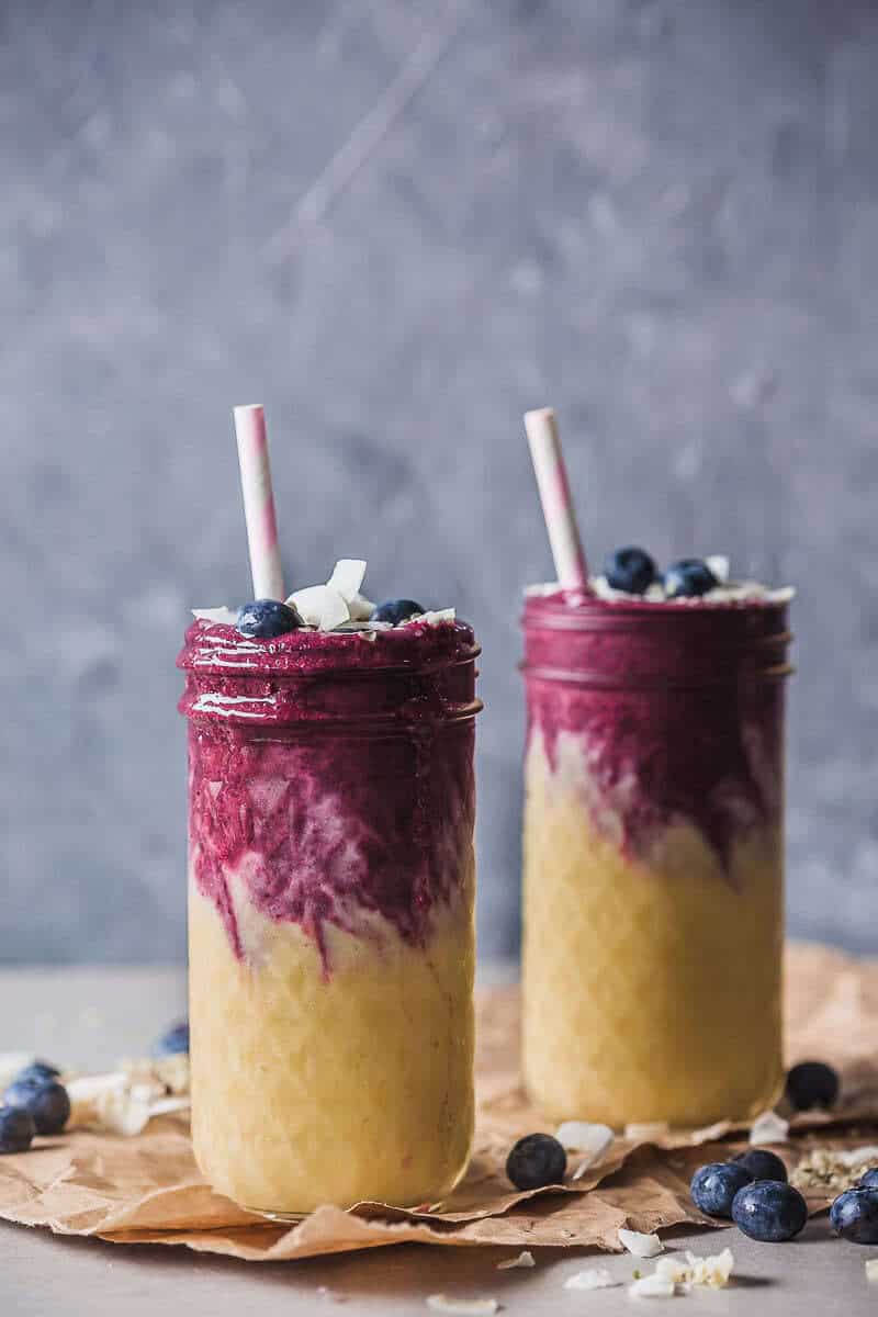 This lovely Mango Blueberry Smoothie uses frozen mango and blueberries and is perfect to maximize your nutrient intake in winter. | Vibrant Plate