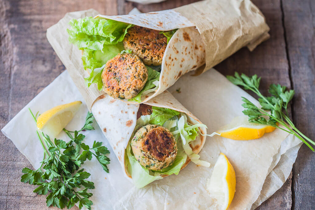 The Easiest Lemon Tahini Falafel Wrap, topped with a delicious Lemon Tahini Sauce is a quick & vegan meal. | www.vibrantplate.com