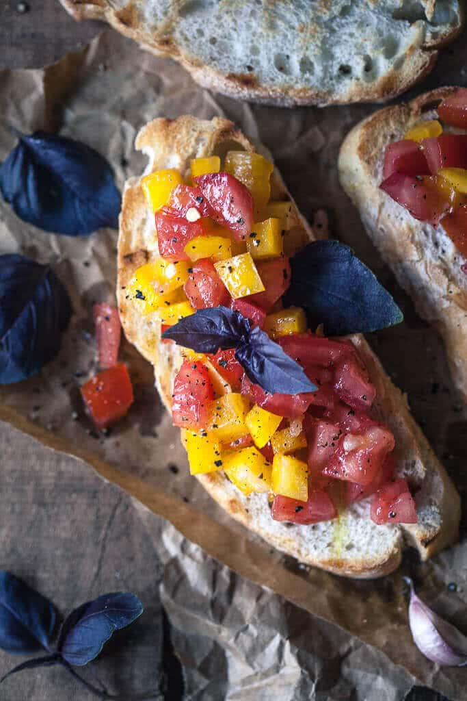 This Classic Italian Tomato Bruschetta is an easy and delicious appetizer of crispy toasted bread and delicious tomato topping. | www.vibrantplate.com