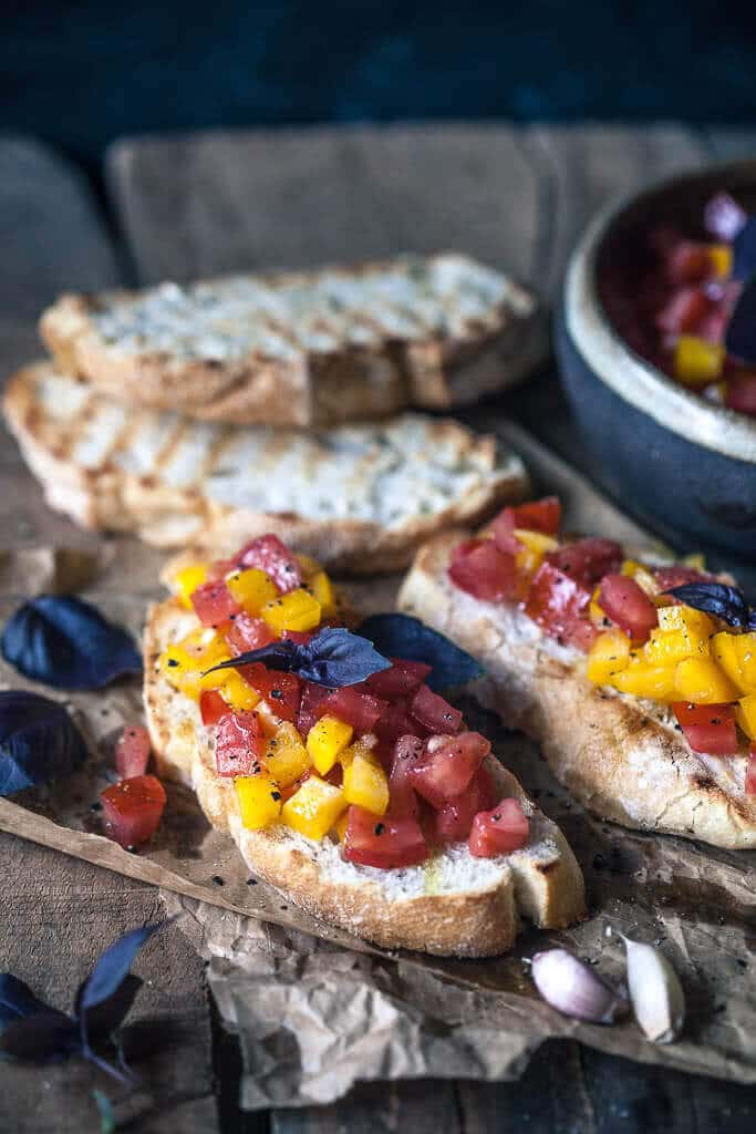 This Classic Italian Tomato Bruschetta is an easy and delicious appetizer of crispy toasted bread and delicious tomato topping. | www.vibrantplate.com