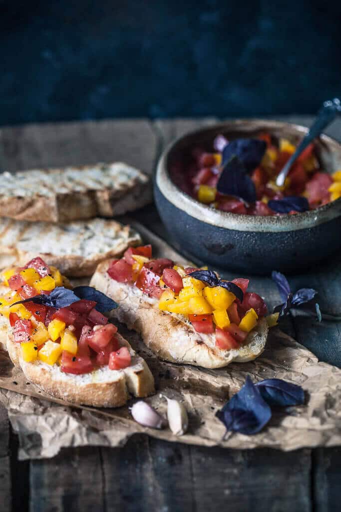 This Classic Italian Tomato Bruschetta is an easy and delicious appetizer of crispy toasted bread and delicious tomato topping. | www.vibrantplate.com