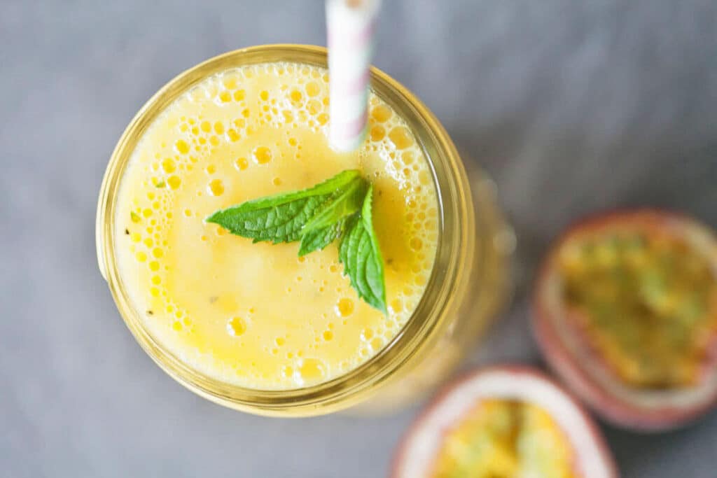 Turn mango and passion fruit into this tropical heaven. This Mango & Passion Fruit Tropical Smoothie is ideal for hot summer days. | www.vibrantplate.com