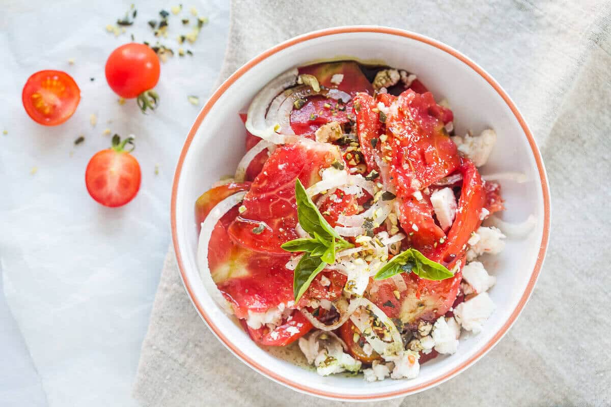 Tomato Salad with Feta Cheese, Onion and Pumpkin Seed Oil | www.vibrantplate.com