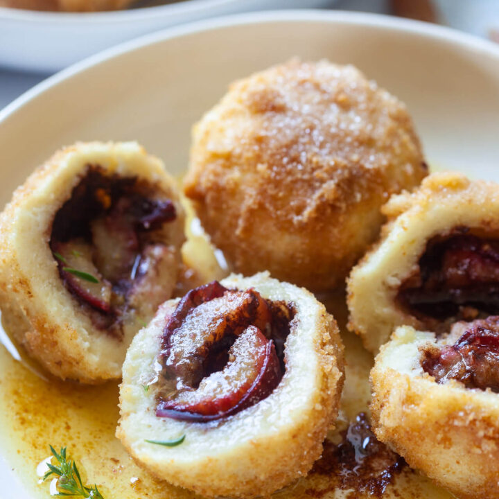 Cinnamon Plum Dumplings with Butter Breadcrumbs Vibrant plate
