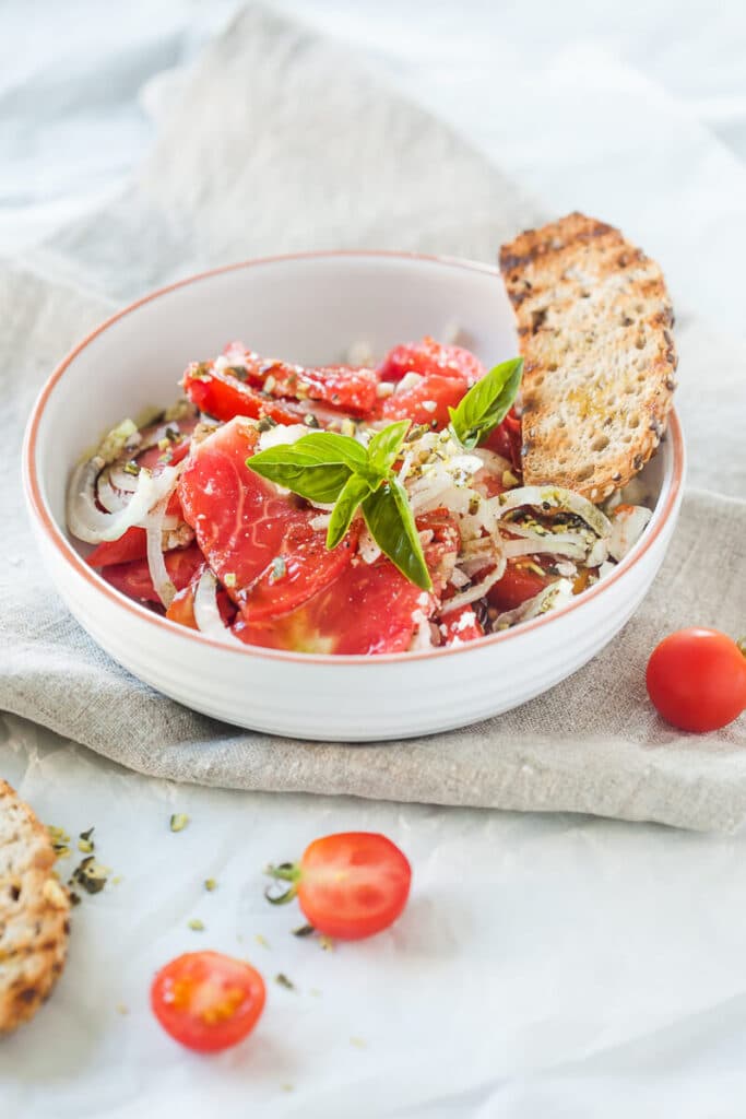 Tomato Salad with Feta Cheese, Onion and Pumpkin Seed Oil | www.vibrantplate.com