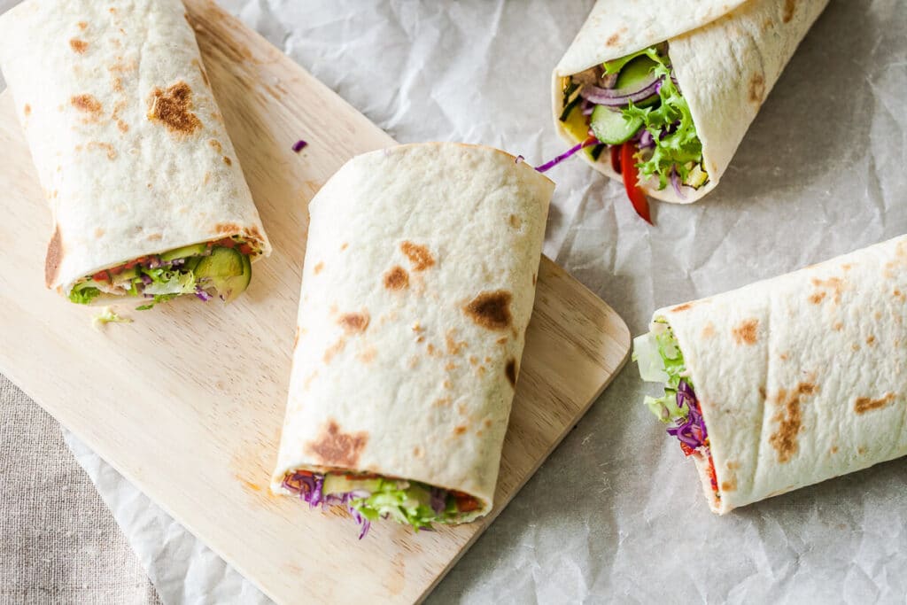 Grilled Veggies Tortilla Wraps with grilled zucchini and peppers, purple cabbage and salad. Super easy to make! | www.vibrantplate.com