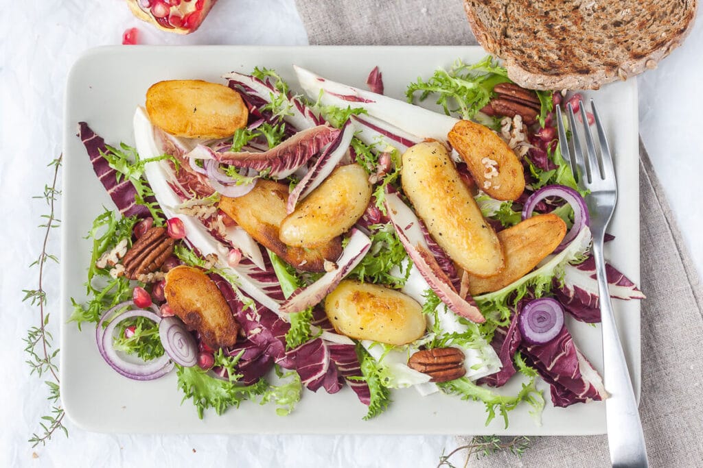 This Radicchio salad with Roasted Potatoes is ideal for colder months. Add Curly Endive for a pop of color! | www.vibrantplate.com