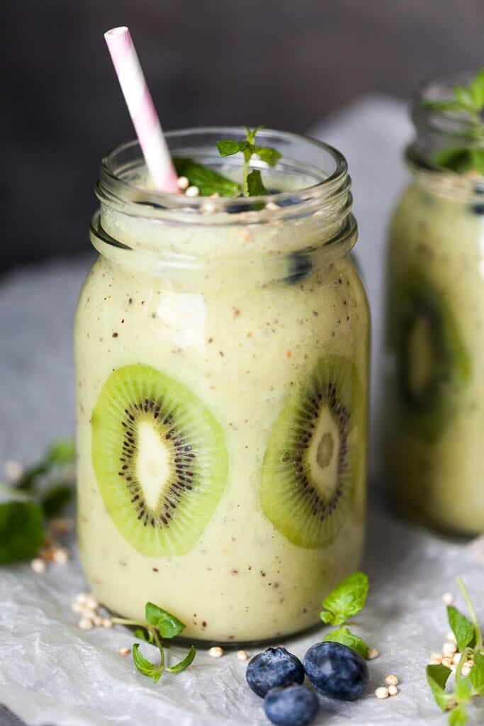 This Kiwi Banana Smoothie with Blueberries looks almost like Spring! Just a couple of minutes and a few ingredients to make. | www.vibrantplate.com