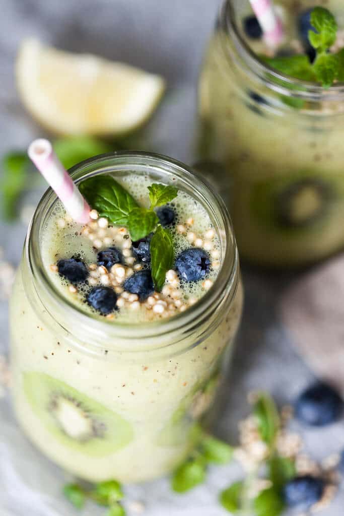 This Kiwi Banana Smoothie with Blueberries looks almost like Spring! Just a couple of minutes and a few ingredients to make. | www.vibrantplate.com