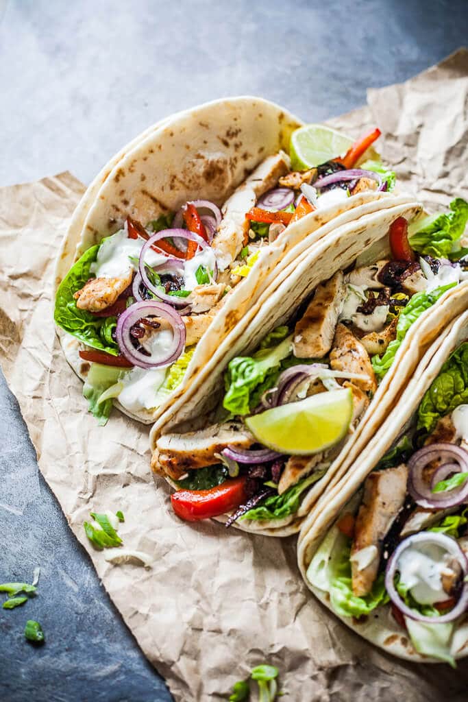 Grilled Chicken Tacos are a healthy and easy meal for every day. Also an excellent to-go meal for the office and a real crowd-pleaser! | www.vibrantplate.com