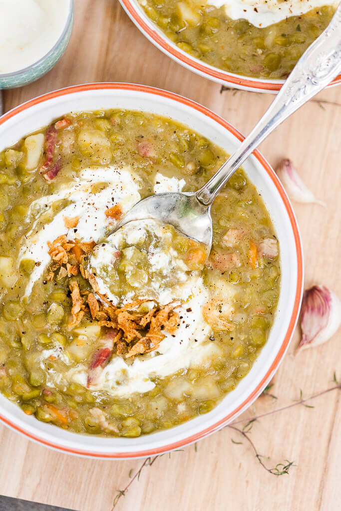 This Split Pea Minestrone Soup is a rustic winter comfort food that will warm you up on a cold day. Skip bacon for a vegetarian option! | www.vibrantplate.com