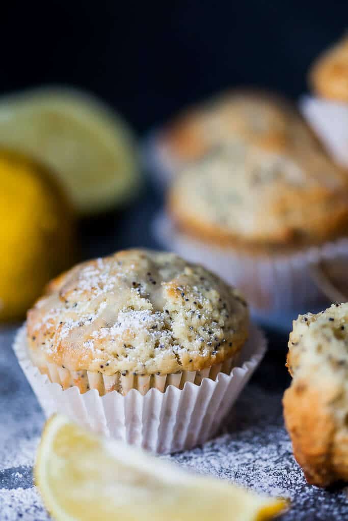 These Lemon Poppy Seed Muffins look simple but pack plenty of flavors, plus they are fluffy, light and delicious. Great for a quick breakfast to-go! | www.vibrantplate.com