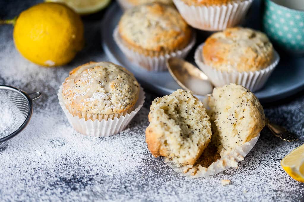 These Lemon Poppy Seed Muffins look simple but pack plenty of flavors, plus they are fluffy, light and delicious. Great for a quick breakfast to-go! | www.vibrantplate.com