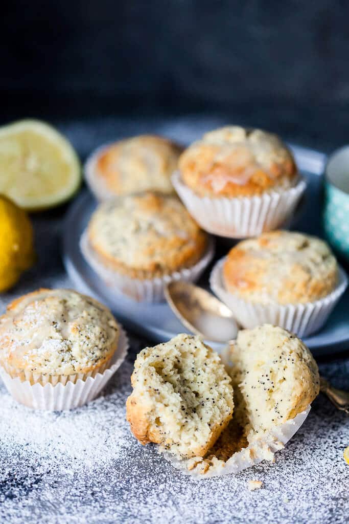 These Lemon Poppy Seed Muffins look simple but pack plenty of flavors, plus they are fluffy, light and delicious. Great for a quick breakfast to-go! | www.vibrantplate.com