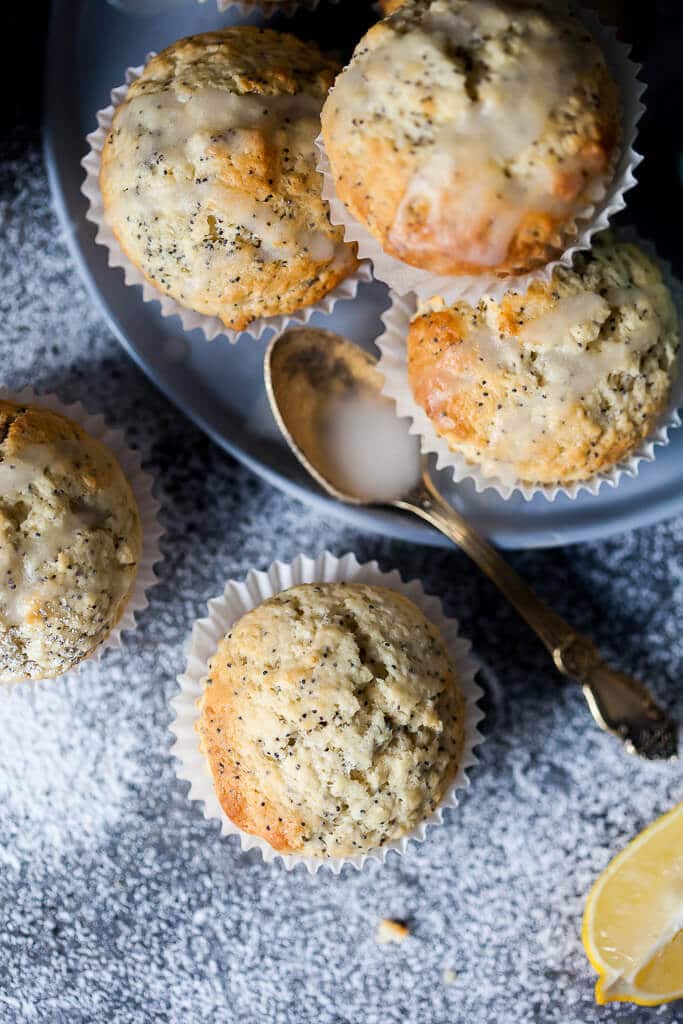 These Lemon Poppy Seed Muffins look simple but pack plenty of flavors, plus they are fluffy, light and delicious. Great for a quick breakfast to-go! | www.vibrantplate.com