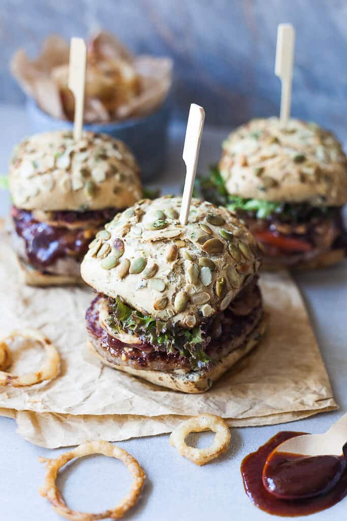 Beer Braised Onion Burgers are the perfect grill recipe! Topped with Crispy Onion Rings for extra crunch. | www.vibrantplate.com