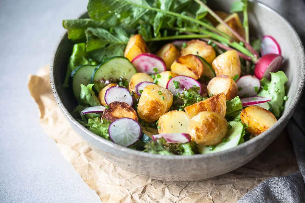 A simple vegan Spring Potato Salad with a delicious Balsamic Vinaigrette, the perfect use of new potatoes! | www.vibrantplate.com