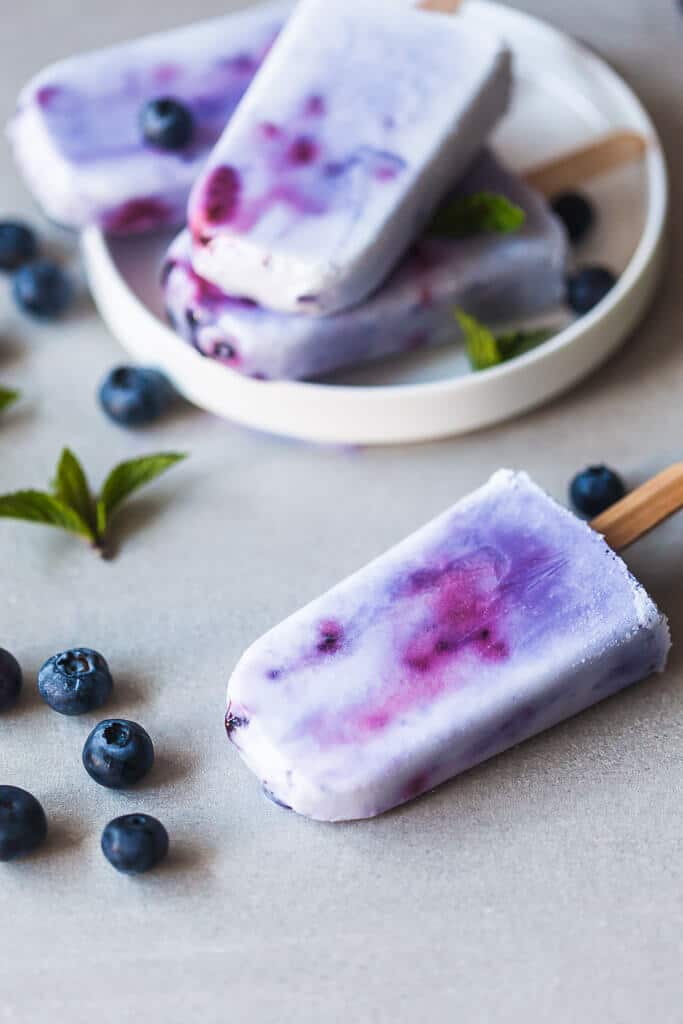 Coconut Blueberry Popsicles are a natural version of the colorful Galaxy Pops! Paleo, Vegan & Gluten-free. | www.vibrantplate.com