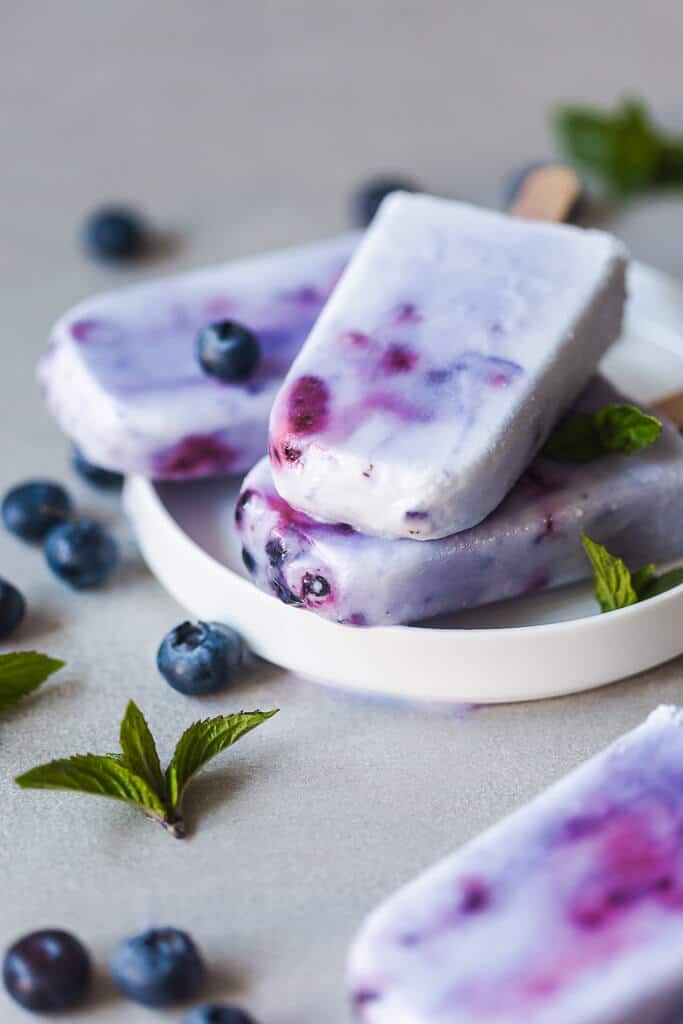 Coconut Blueberry Popsicles are a natural version of the colorful Galaxy Pops! Paleo, Vegan & Gluten-free. | www.vibrantplate.com