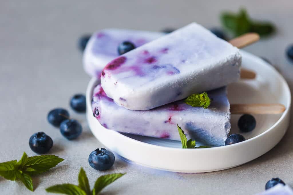 Coconut Blueberry Popsicles are a natural version of the colorful Galaxy Pops! Paleo, Vegan & Gluten-free. | www.vibrantplate.com