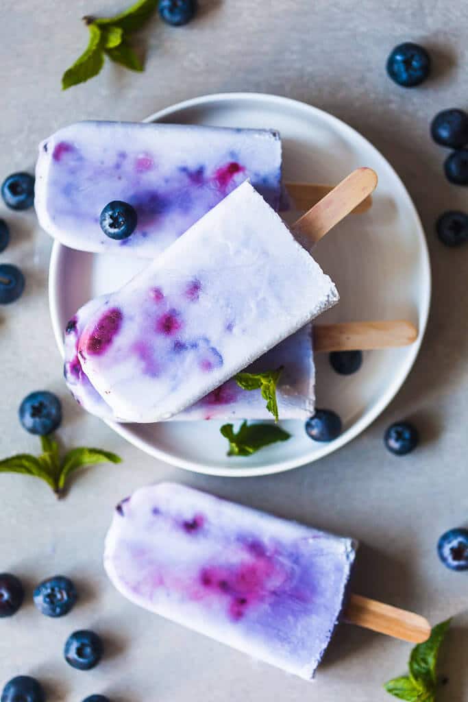 Coconut Blueberry Popsicles are a natural version of the colorful Galaxy Pops! Paleo, Vegan & Gluten-free. | www.vibrantplate.com