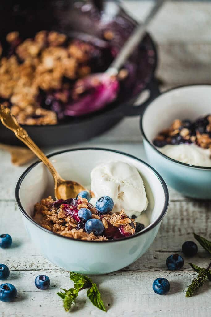 Crispy Berries and Plum Crumble is an easy and delicious vegan dessert that makes excellent use of fruit you have rolling around. | Vibrant Plate