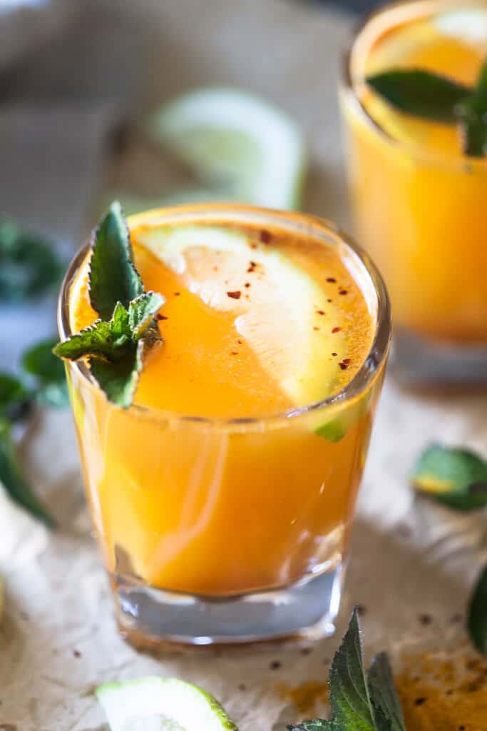 Yellow Glow Energizing Water with Turmeric, Ginger, Cinnamon, and Chili to help you boost your immune system. | Vibrant Plate