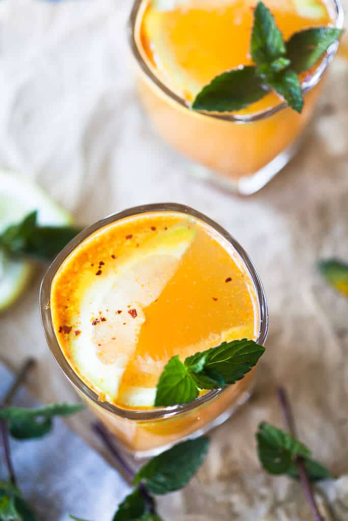 Yellow Glow Energizing Water with Turmeric, Ginger, Cinnamon, and Chili to help you boost your immune system. | Vibrant Plate