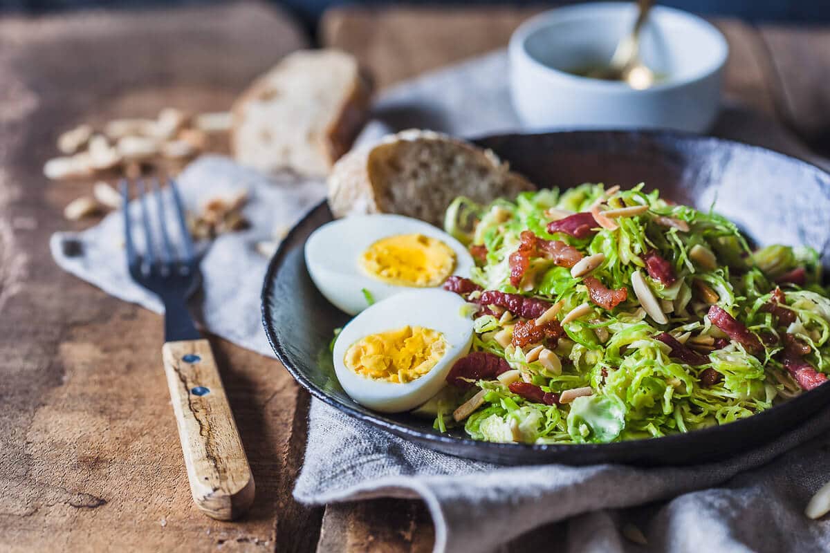 Not your standard salad, this Brussels Sprout Salad with Bacon and Eggs is a fresh take on the humble vegetable. | Vibrant Plate