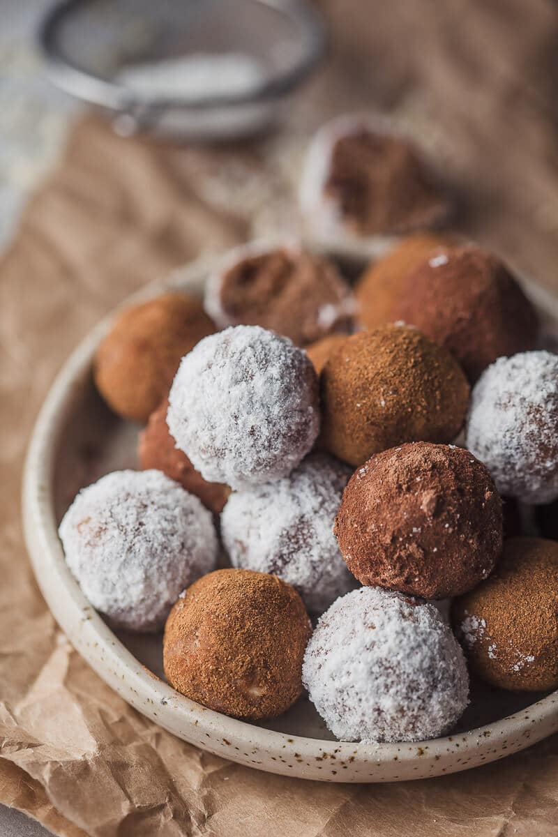 A close up picture of Almond pulp energy bites on a plate.