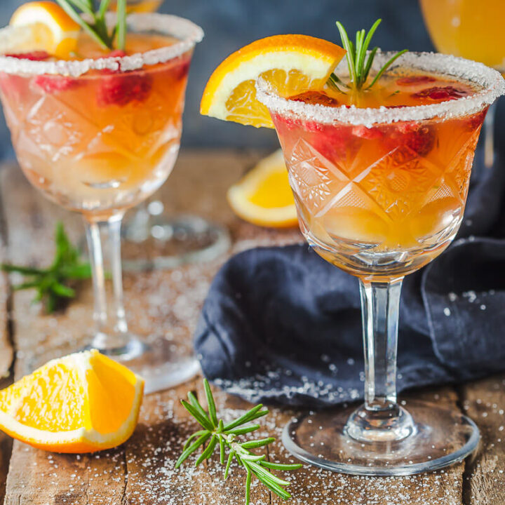 An excellent brunch drink, this Orange Raspberry Mimosa Cocktail is the perfect fit to celebrate the arrival of spring! | Vibrant Plate