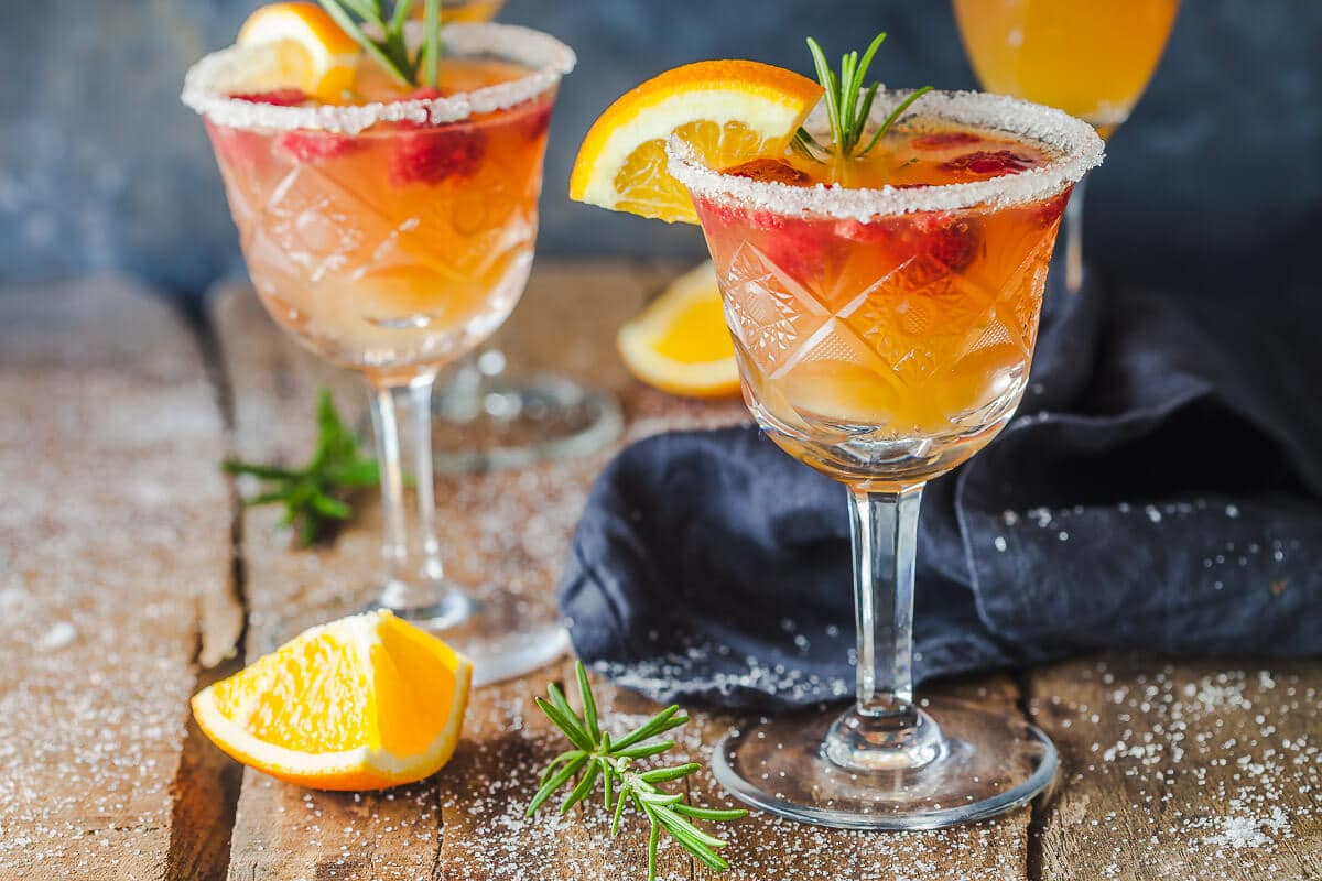 An excellent brunch drink, this Orange Raspberry Mimosa Cocktail is the perfect fit to celebrate the arrival of spring! | Vibrant Plate