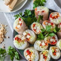 These colorful Vegan Tofu Spring Rolls are paired with a delicious peanut dipping sauce. A delicious gluten-free meal in just 30 minutes! | Vibrant Plate