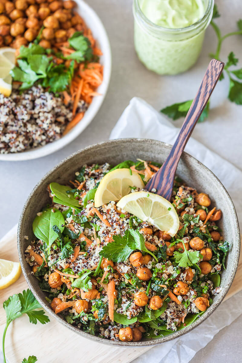 This Vegan Quinoa Buddha Bowl uses kale and roasted chickpeas and is completed by a delicious Avocado Cream Dressing! | Vibrant Plate