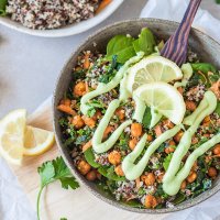 This Vegan Quinoa Buddha Bowl uses kale and roasted chickpeas and is completed by a delicious Avocado Cream Dressing! | Vibrant Plate