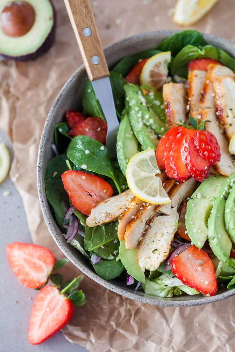 A beautiful spring Strawberry Spinach Salad with Grilled Chicken and Avocado for a healthy and filling meal! | Vibrant Plate