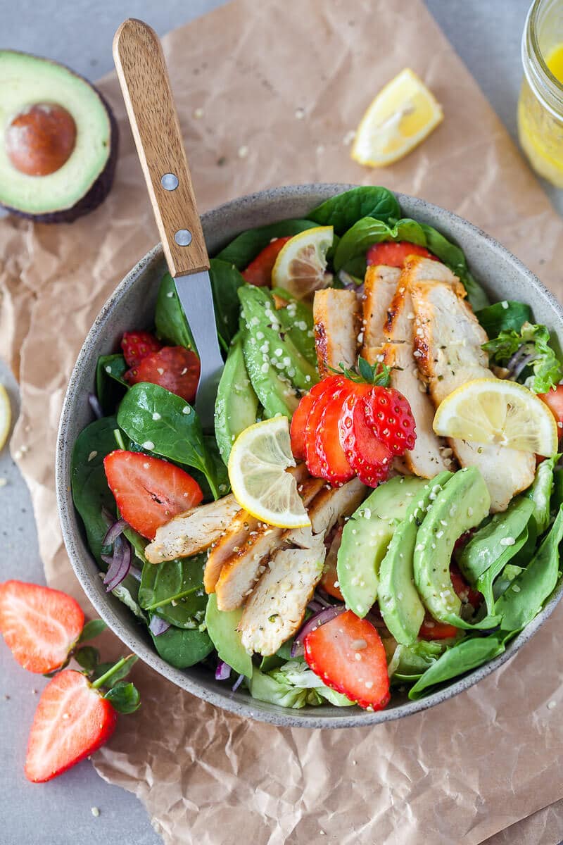A beautiful spring Strawberry Spinach Salad with Grilled Chicken and Avocado for a healthy and filling meal! | Vibrant Plate