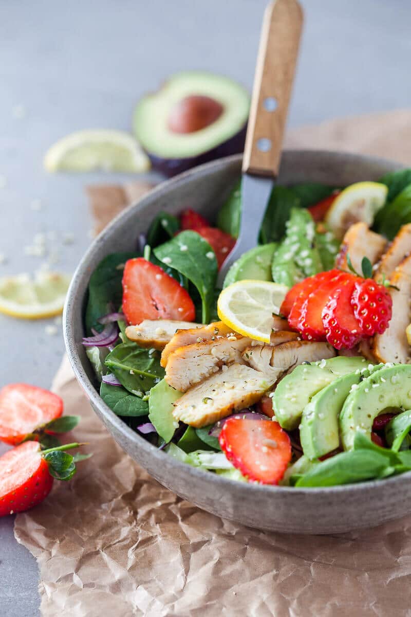 A beautiful spring Strawberry Spinach Salad with Grilled Chicken and Avocado for a healthy and filling meal! | Vibrant Plate