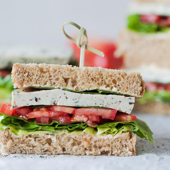 This Vegan Basil Tomato Tofu Sandwich is a quick and easy summer snack idea. Ready in 15 minutes! | Vibrant Plate