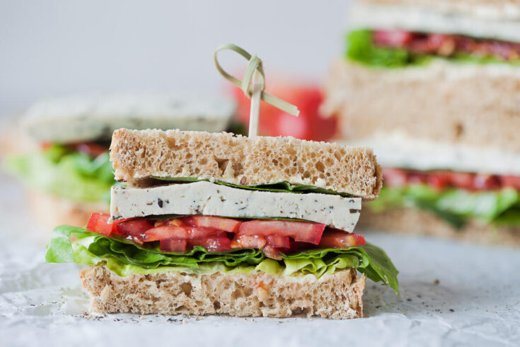This Vegan Basil Tomato Tofu Sandwich is a quick and easy summer snack idea. Ready in 15 minutes! | Vibrant Plate