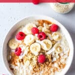 Vegan quinoa breakfast bowl with raspberries on top, pictured from the above.