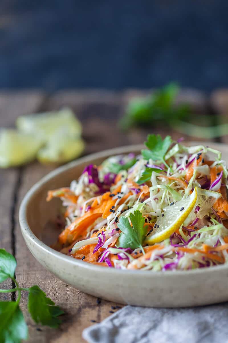 Vegan No Mayo Coleslaw is a light and fresh summer classic without the calories! Just fresh vegetables and a delicious mustard dressing. | Vibrant Plate