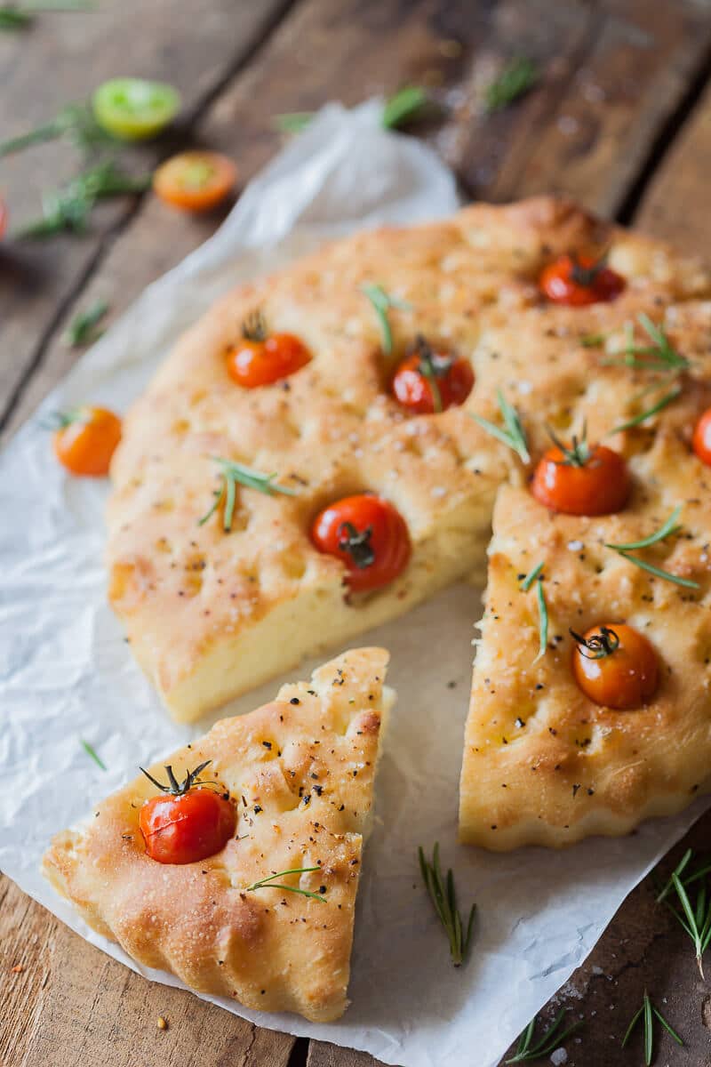 This Cherry Tomato Vegan Focaccia is topped with fragrant cherry tomatoes, coarse salt, and aromatic pizza herbs. | Vibrant Plate