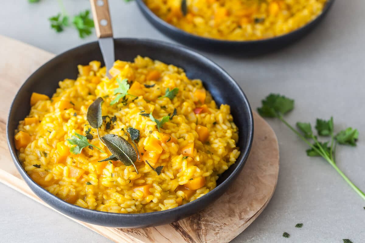 A creamy Vegan Pumpkin Puree Sage Risotto is the perfect meal on a rainy day. Easy & Gluten-Free! | Vibrant Plate