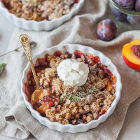 A simply delicious Peach and Plum Vegan Crumble with a crunchy oat and almond topping is a great warm dessert on a cold day. | Vibrant Plate