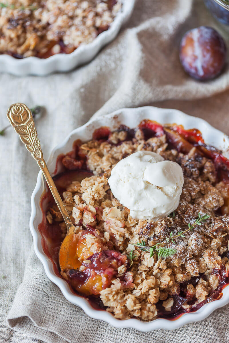 A simply delicious Peach and Plum Vegan Crumble with a crunchy oat and almond topping is a great warm dessert on a cold day. | Vibrant Plate