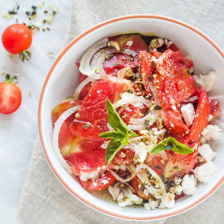 Tomato Salad with Feta Cheese, Onion and Pumpkin Seed Oil