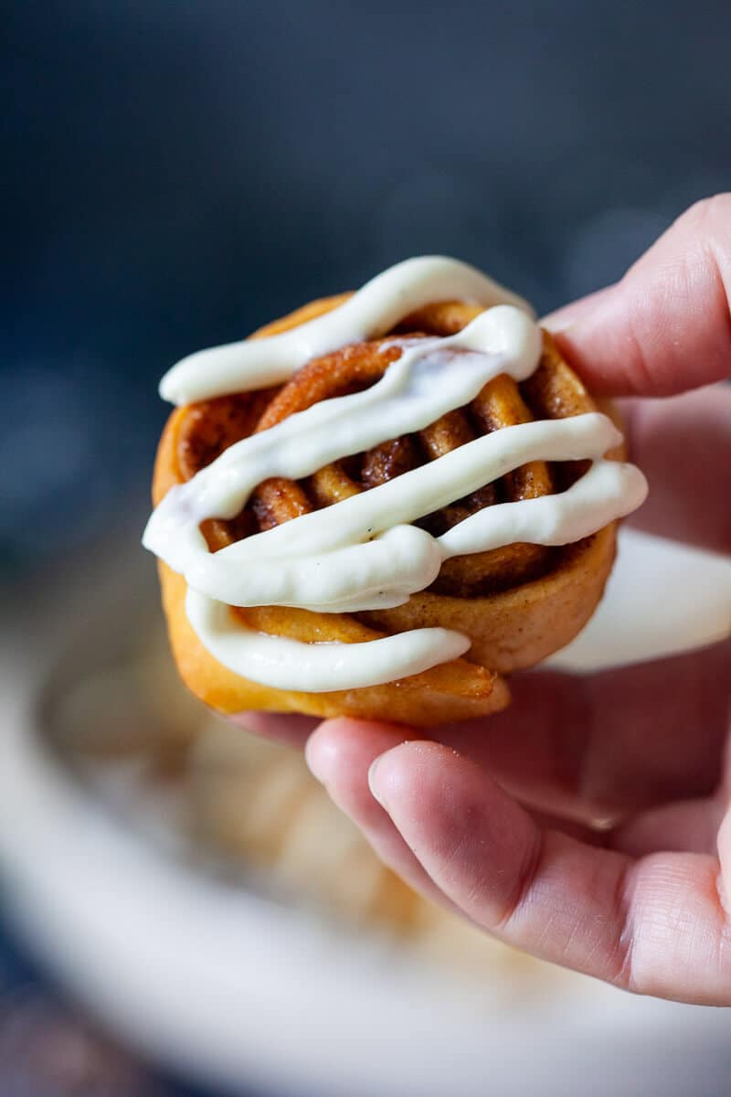 Vegan Pizza Dough Cinnamon Rolls In hand