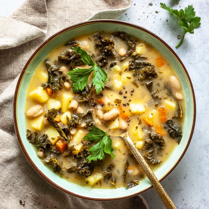 Vegan White Bean and Kale Soup on table