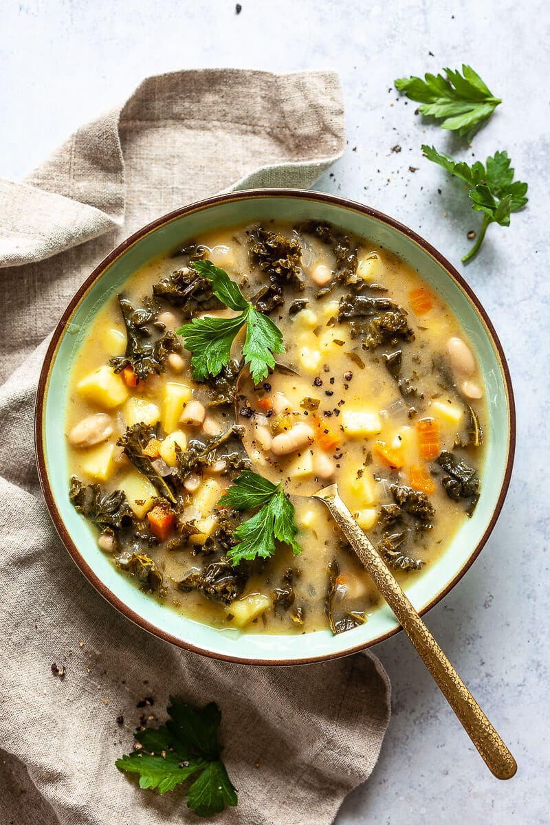 Vegan White Bean and Kale Soup on table